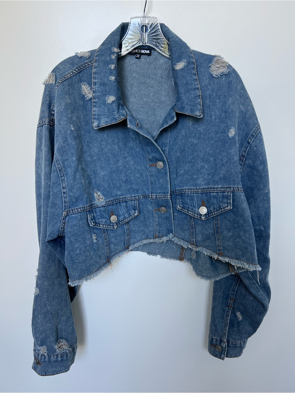 Cropped women’s distressed denim jacket